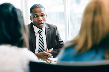 insurance agent talking with customers