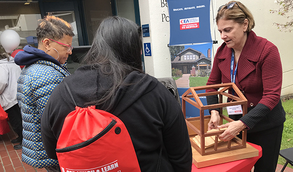 Image: CEA Chief Mitigation Officer Janiele Maffei, doing a hands-on demonstration about retrofitting